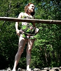 Charming red-haired teen cutie pees off the bridge