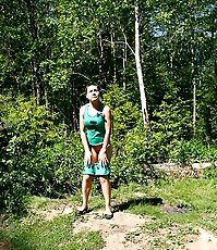 Young girl slides out of her shorts to pee quickly