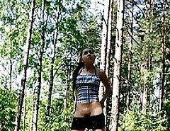 Teeny enjoys the view while peeing in the forest