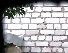 Cute chick spycamed pissing by the wall