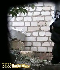 Medical school graduate pissing outdoors