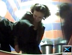 Unsuspecting hotties busted watering in toilet