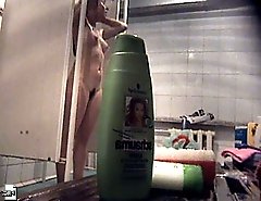 Joyful young puss with bushy pubis takes a shower