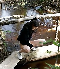 Spy busts a hot young chick pissing into the river