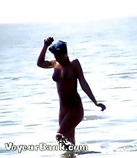 Voyeur tapes a gorgeous babe at the nudist beach