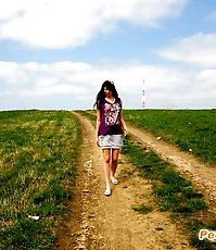 Emo chick pissing in the middle of a country road