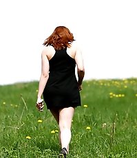 Sexy shortie busted tinkling in a flowery field