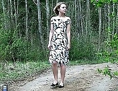 Kinky girl pisses in the middle of a forest road