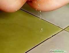 Teenage slut pissing onto the living room floor