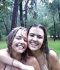 Beautiful teens get recorded in bikinis under the rain