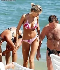 Bikini girls playing around on beach