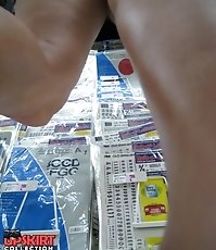 Blue mini hides great view. Up skirts a sneak peek