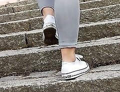 Horny tight jeans girl on the stairs