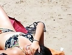 Bikini girls in sexy poses on beach