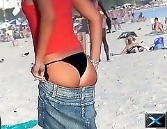 Guy spied the beautiful well shaped body of long legged bimbo in the hot micro bikini
