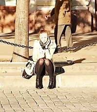 Blonde girl in green hose up skirt
