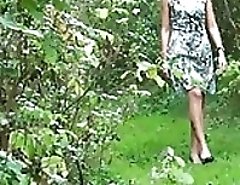 The blonde in yellow pantyhose poses on a sofa hoists legs shows a silky body