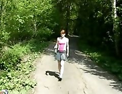 Adorable redhead tinkles on deserted country road