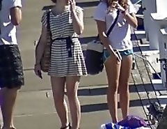 Voyeured girls in swimsuits on beach