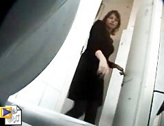 Voyeur peeps after mature and younger babe in market toilet