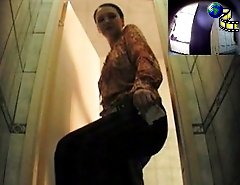 Young lady squats to empty her bladder in the WC
