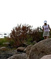 Hot teen smoker piddling off the rock in the park