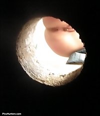 Meaty peeing pussy shot through a hole