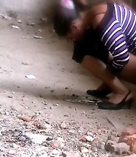 Voyeur view of a lovely chick doing a piss selflessly