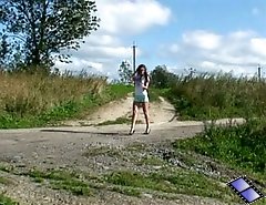 Raunchy teenage candy pees on an empty dirt road
