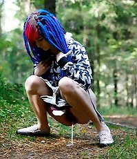 Young cutie empties her bladder in the forest
