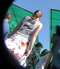 Slim babe in short skirt had her pink panty upskirt spied