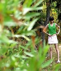 Little babe takes a leak in the nearby bushes