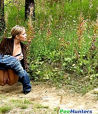 Blonde ho pissing in the middle of a country road
