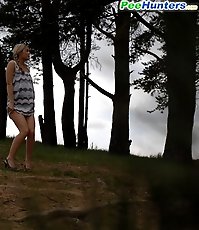 Cute babe goes out commando and pisses in the woods