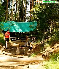 Careless puss peeing on a beautiful forest glade