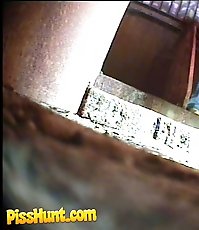 Pissing girl get busted and filmed in public loo