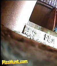 Pissing girl get busted and filmed in public loo