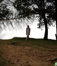 Cute babe goes out commando and pisses in the woods