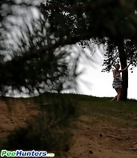Cute babe goes out commando and pisses in the woods