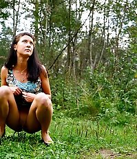 Cute babe plays watersports on a quiet forest glade