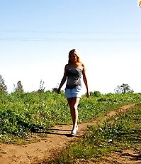 Cute teeny pissing in the middle of the country road