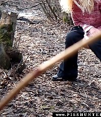 Young blonde takes a quick pee in a nice park