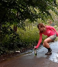 Wasted ho squats down to pee right on the street