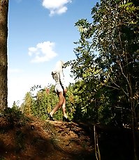 Shameless young blonde tart caught peeing on forest path