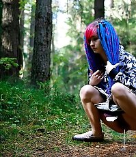 Young cutie empties her bladder in the forest