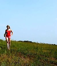 Cute teen blondie pissing naked in the hills