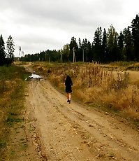 Beautiful brunette filmed pissing behind the bush