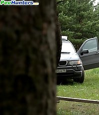 Prankish girl pees onto a bench at a camping site