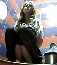Two peeing blondies spied after in a public toilet
