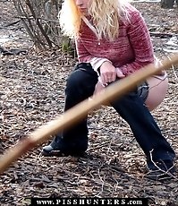 Young blonde takes a quick pee in a nice park